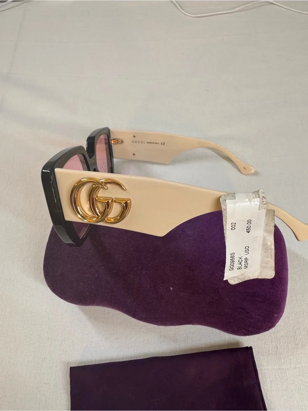 Gucci Women’s Black Frame Sunglasses with Purple Lenses and Purple Case